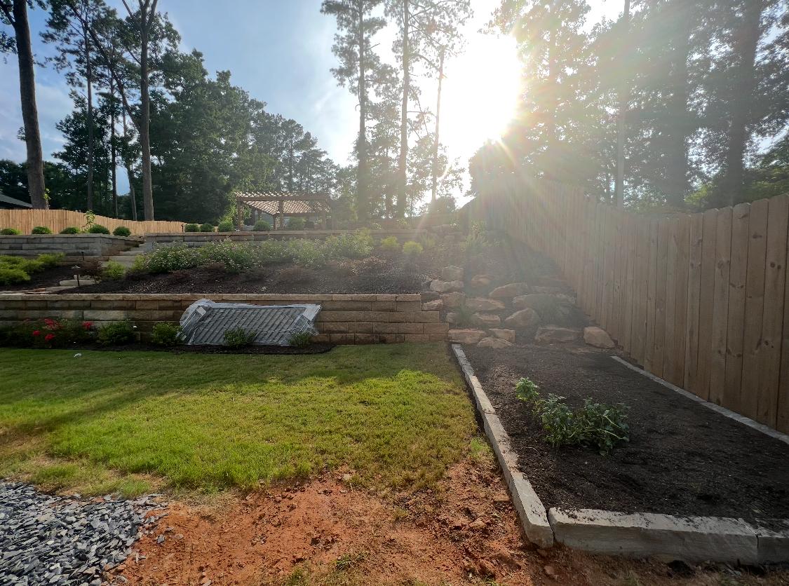 Terraced backyard before lighting and planting upgrades